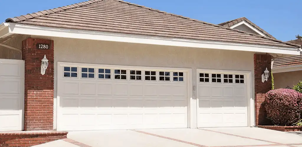 Residential garage door repair service for a double garage door in Milwaukee, WI