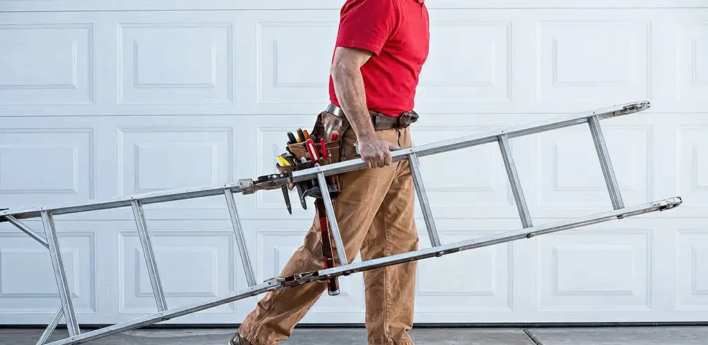 Garage door repair technician arriving with tools and ladder in Milwaukee, WI