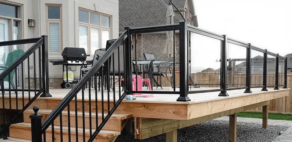 Handrail installation on a deck staircase for safety and code compliance in Milwaukee, WI